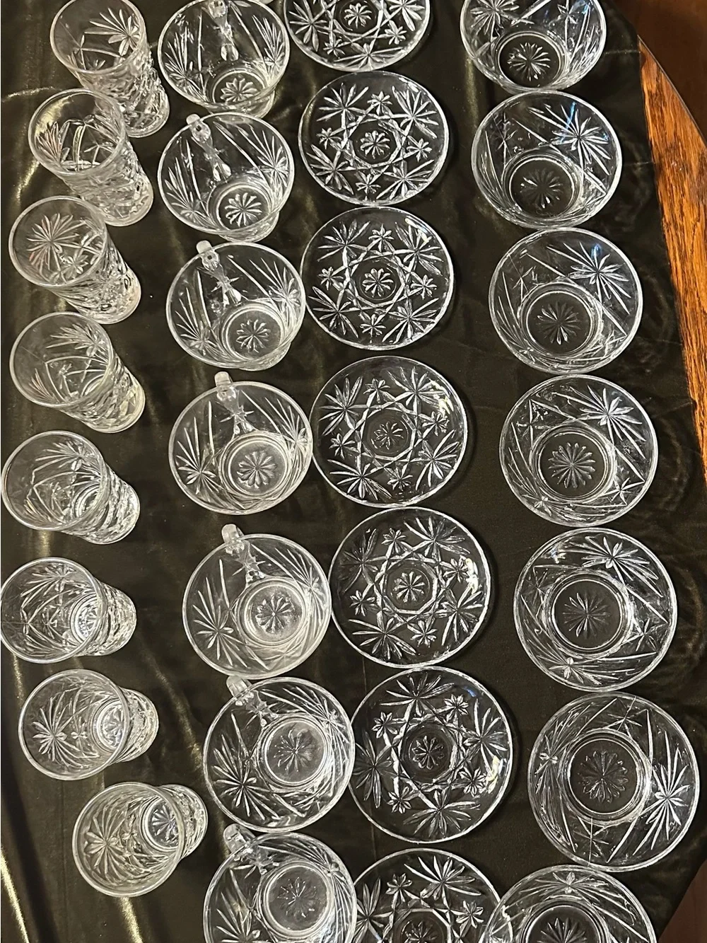 Pressed glass 8 piece setting of: cups w/handle, saucer, small bowls and glasses